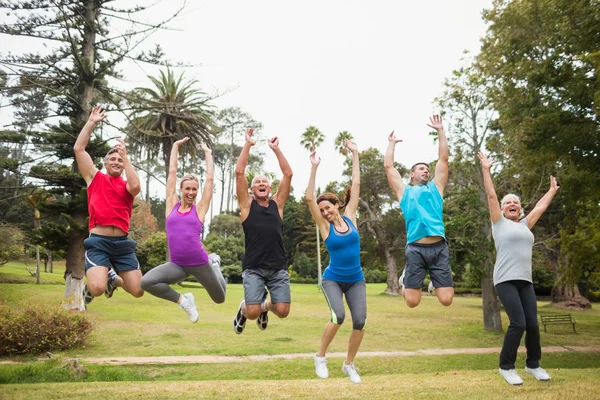 Happy athletic jumping together — Stock Photo, Image