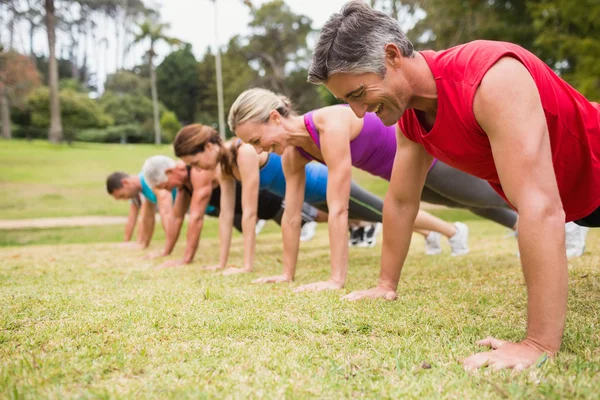 Happy athletic group training — Stock Photo, Image