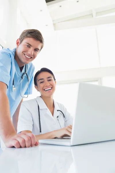 Happy doctors looking at camera — Stock Photo, Image