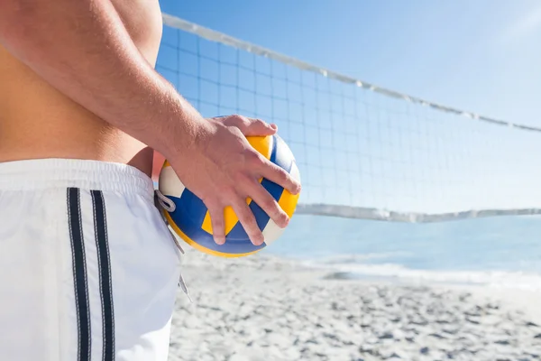 Handsome man holding volleyball — Stock Photo, Image