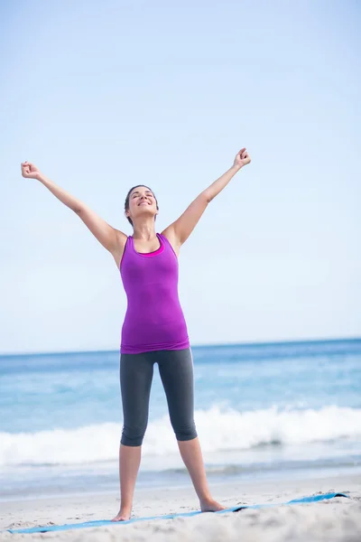 Pretty brunette raising arms — Stock Photo, Image