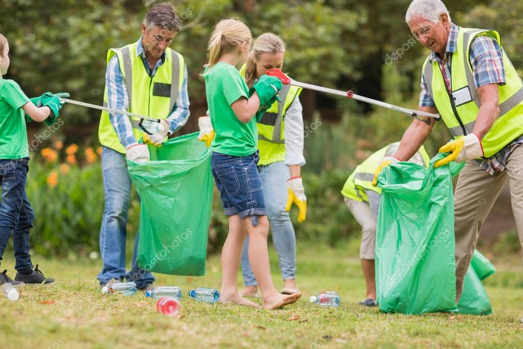 Happy family collecting rubbish Stock Photo by ©Wavebreakmedia 76352835