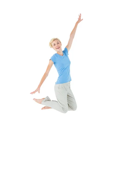 Cheerful blonde woman jumping — Stock Photo, Image