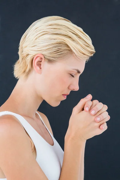 Pretty blonde woman praying — Stock Photo, Image