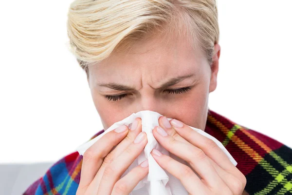 Sick blonde woman blowing nose — Stock Photo, Image