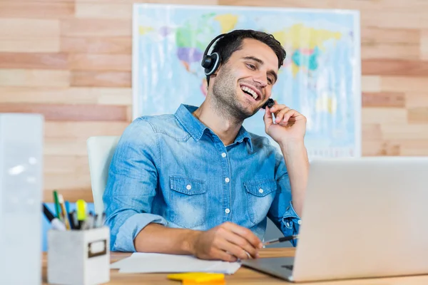 Handsome travel agent speaking with customer — Stock Photo, Image