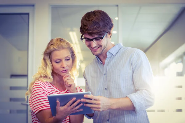 Colleagues looking at tablet pc together — Stock Photo, Image