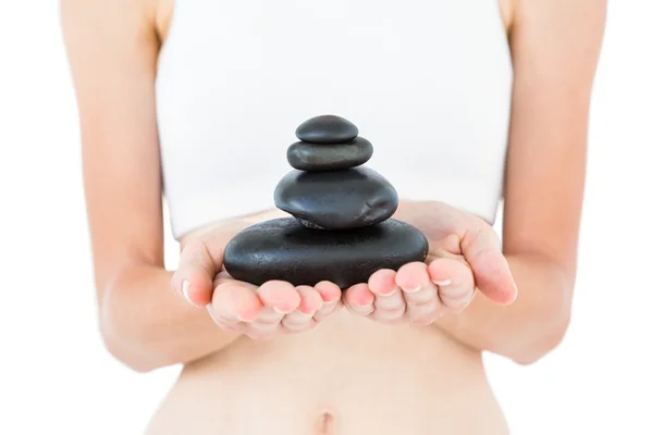 Fit woman holding stones — Stock Photo, Image