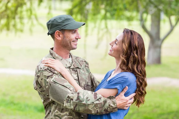 Handsome soldier reunited with partner — Stock Photo, Image