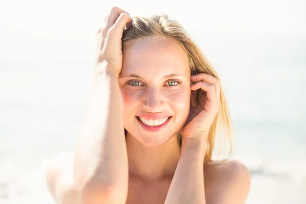Blonde woman on sunny day at beach — Stok fotoğraf