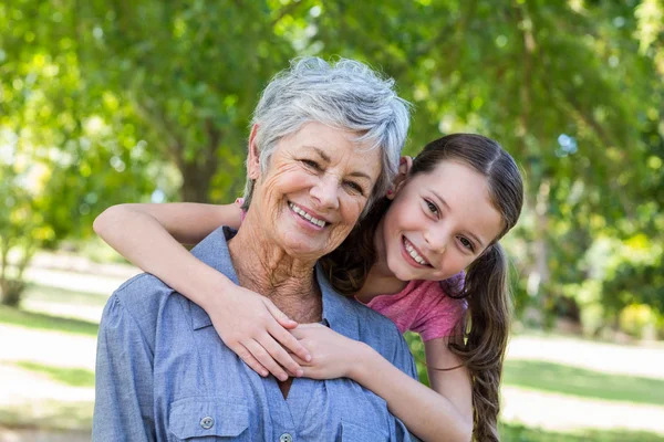 Granddaughter and grandmother smilling — Stockfoto