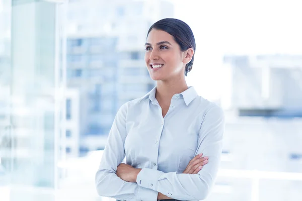 Businesswoman with arms crossed at office — Stock Photo, Image