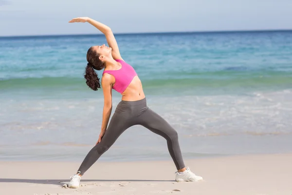 Fit woman stretching her back — Stok fotoğraf