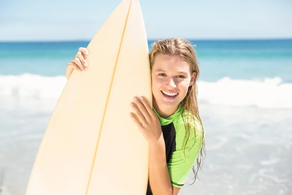 Pretty blonde woman holding surf board — Stock Photo, Image