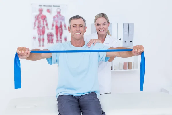 Doctor examining her patient back — Stock Photo, Image