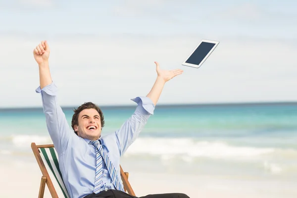 Businessman launching his tablet computer — Stock Photo, Image
