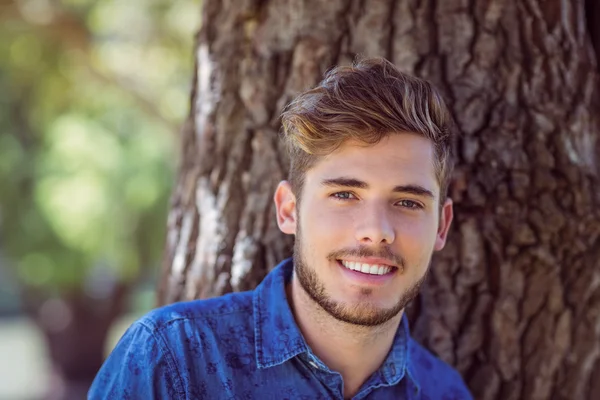 Handsome hipster smiling at camera — Stock Photo, Image