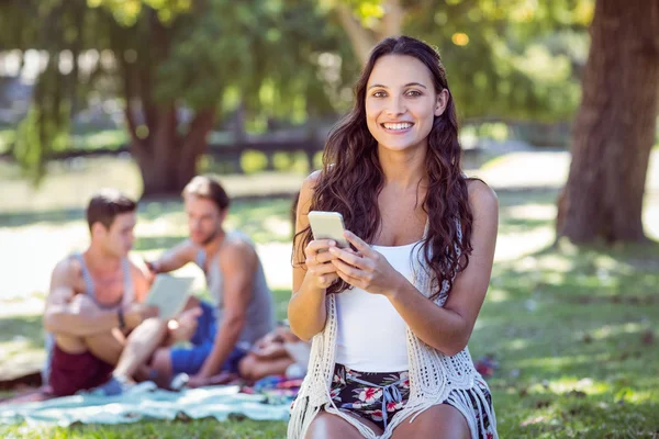 Pretty hipster using her smartphone — Stock Photo, Image