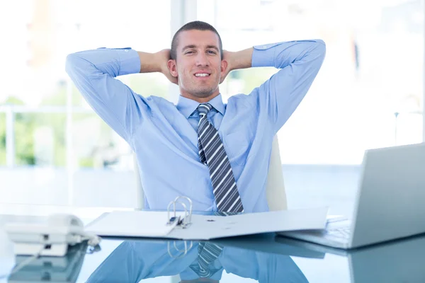 Businessman relaxing in swivel chair — Stock Photo, Image