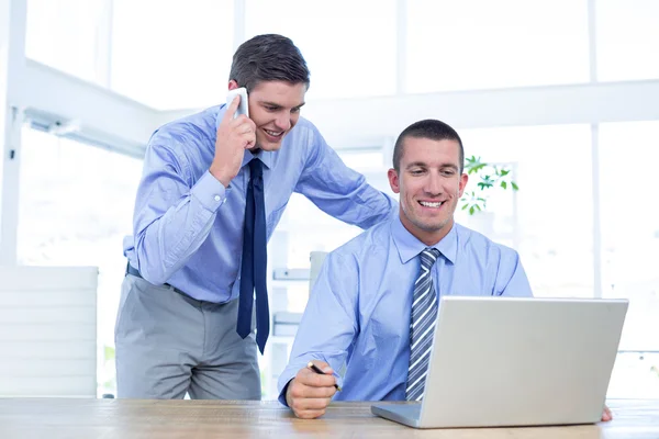 Businessmen using laptop — Stock Photo, Image