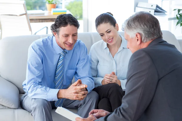 Couple in meeting with a financial adviser — Stock Photo, Image