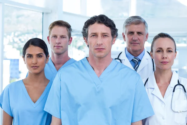 Serious doctors looking at camera — Stock Photo, Image