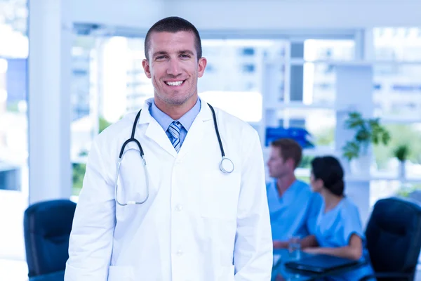 Doctor smiling at the camera — Stock Photo, Image