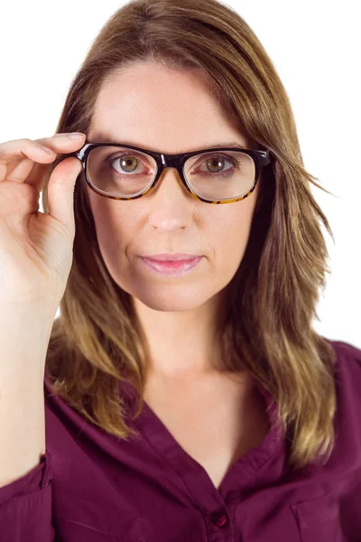 Pretty woman with glasses looking at camera — Stockfoto