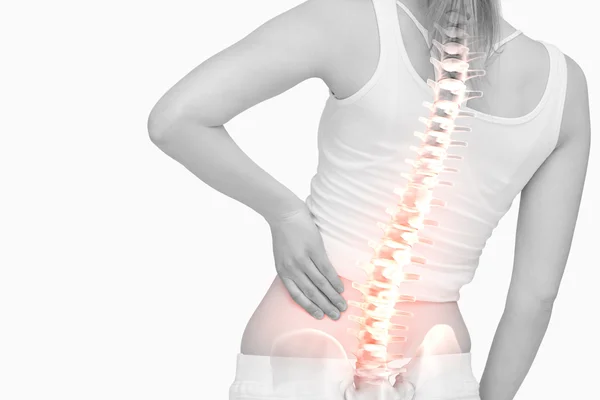 Highlighted spine of woman with back pain — Stock Photo, Image