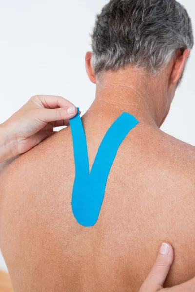 Doctor examining her patient back — Stock Photo, Image