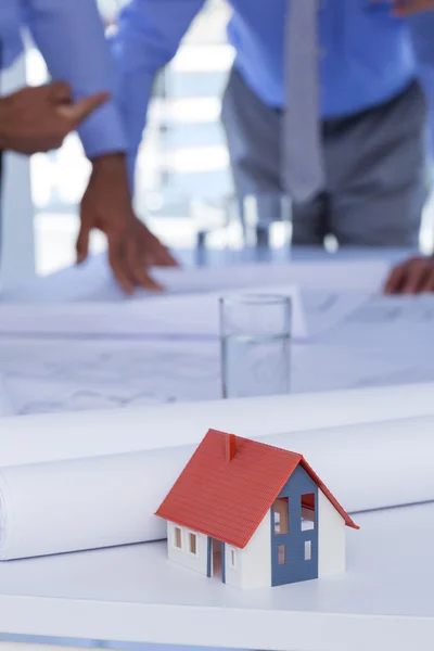 Business people looking at construction plan — Stock Photo, Image