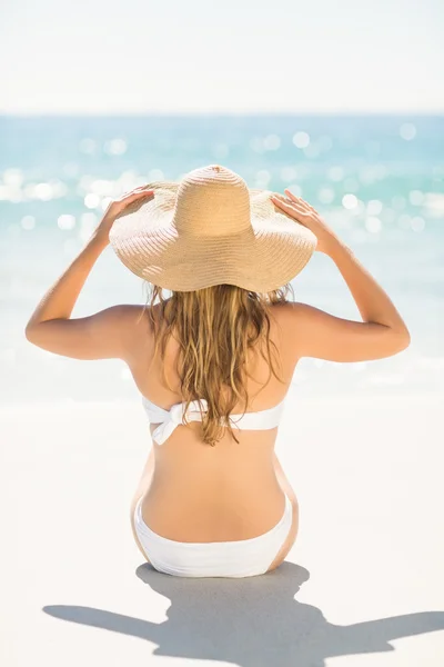 Wear view of blonde woman looking at the sea — Stok fotoğraf