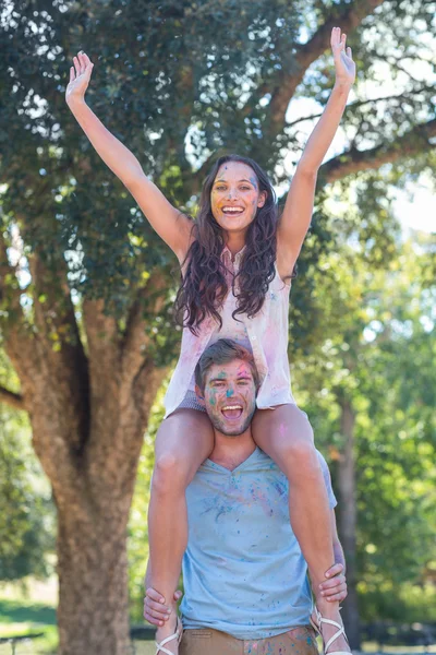 Happy friends covered in powder paint — Stock Photo, Image