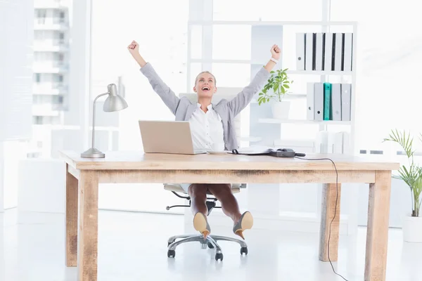 Happy businesswoman with raised arms — Stock Photo, Image