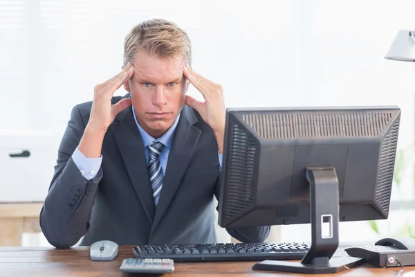 Businessman with his hand on his forehead — Stok fotoğraf