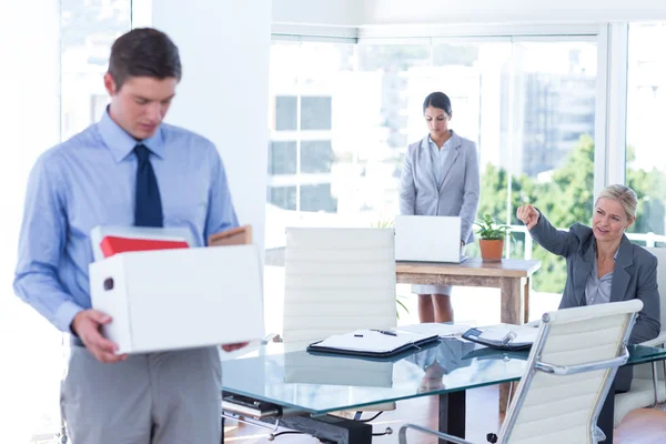 Businesspeople carrying their belongings in box — Stock Photo, Image