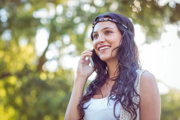 Pretty hipster on the phone in the park — Stok fotoğraf