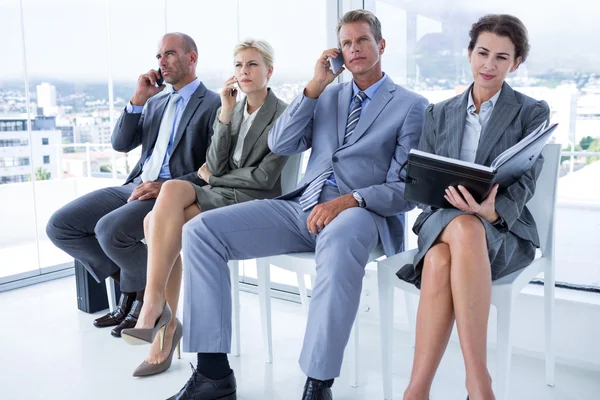 Business people waiting to be called into interview — Stock Photo, Image