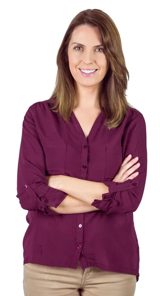 Pretty brunette smiling at camera with arm crossed — Φωτογραφία Αρχείου