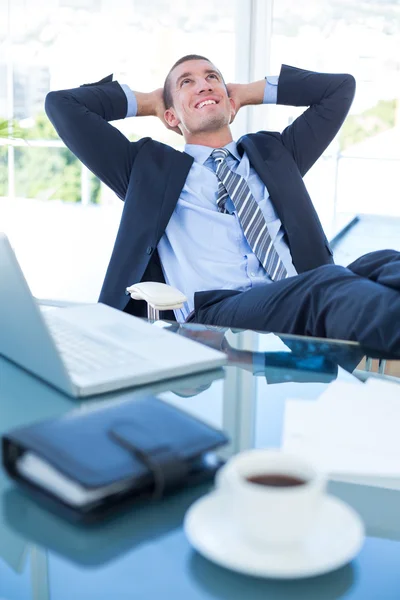 Businessman relaxing in swivel chair — Stock Photo, Image