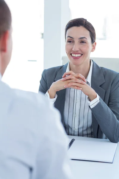 Businesswoman conducting an interview with businessman — Stock Photo, Image