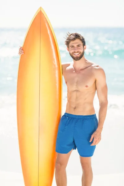 Handsome man holding surfboard — Stock Photo, Image