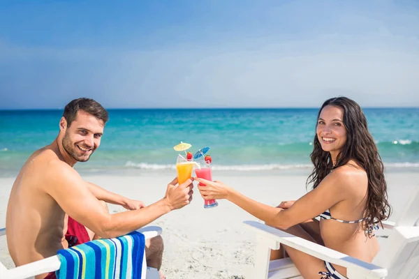 Happy couple drinking a cocktail together — Stock Fotó