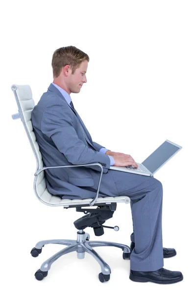 Handsome businessman using his laptop — Stock Photo, Image