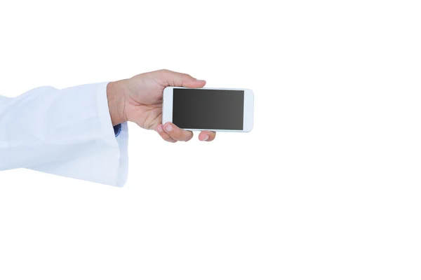 Doctor holding a mobile phone — Stock Photo, Image