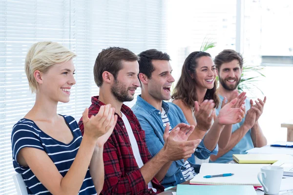 Colleagues clapping hands in meeting — Stock Photo, Image