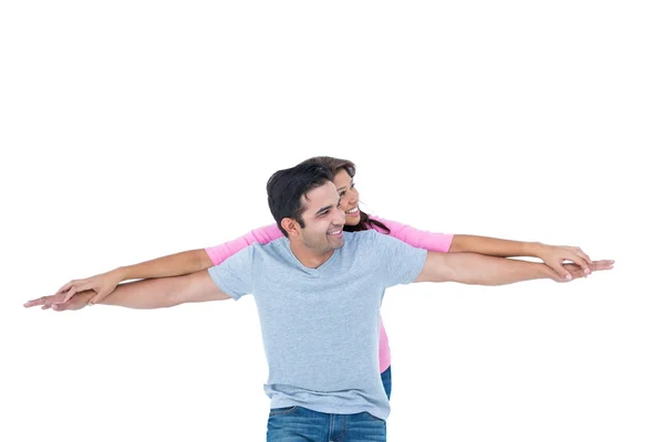 Homem dando sua namorada porquinho de volta — Fotografia de Stock