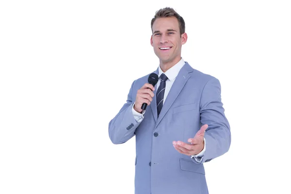 Happy businessman speaking with micro — Stock Photo, Image