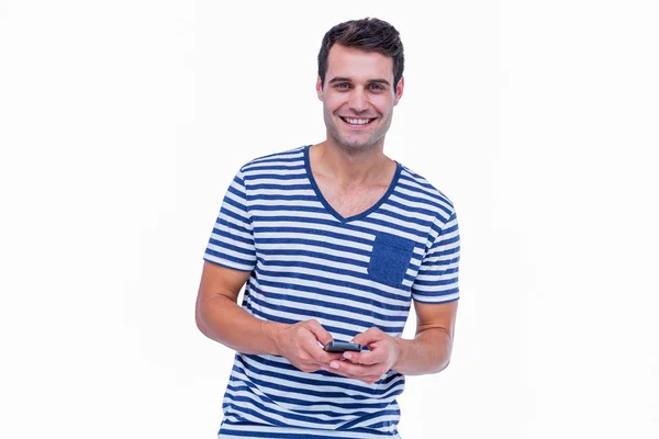 Hipster smiling using smartphone — Stock Photo, Image