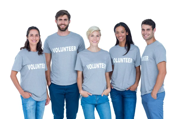 Volunteers friends smiling at the camera — Stock Photo, Image